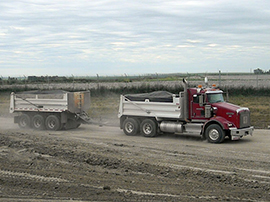 Truck and Tri-Pup used by construction materials company for delivery