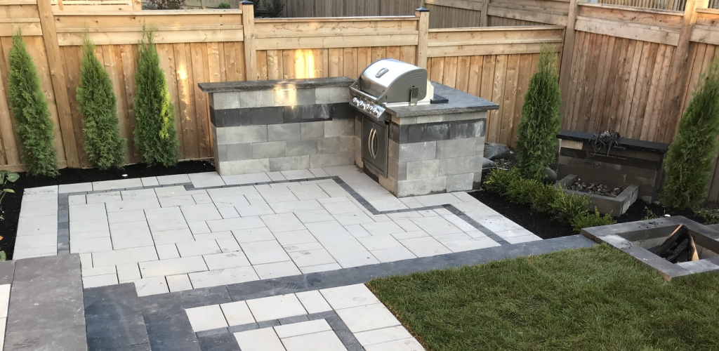 Outdoor Kitchen Installation and Firepit construction services by Green Crew Contracting Inc