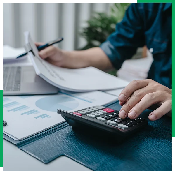 Bookkeeper preparing year-end tax reports for a small business