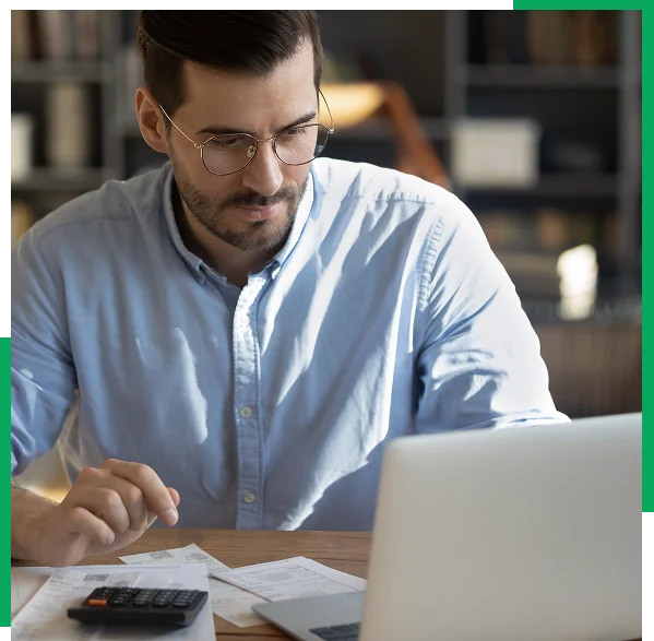 Small business owner using online bookkeeping from a home office