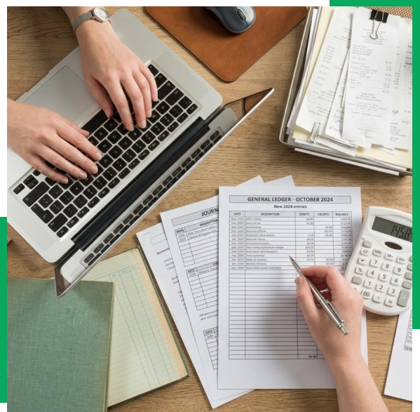Accountant preparing year-end tax reports on a computer