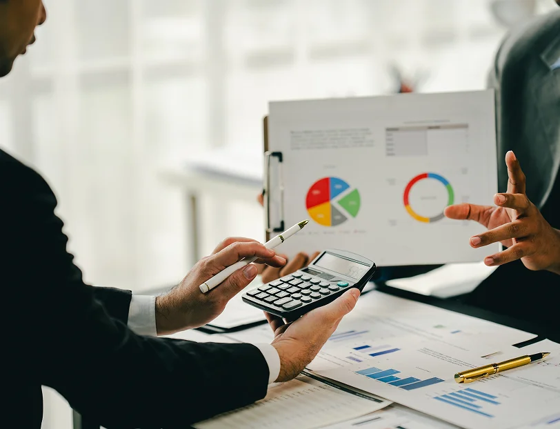 Business owner reviewing financial records with a bookkeeper