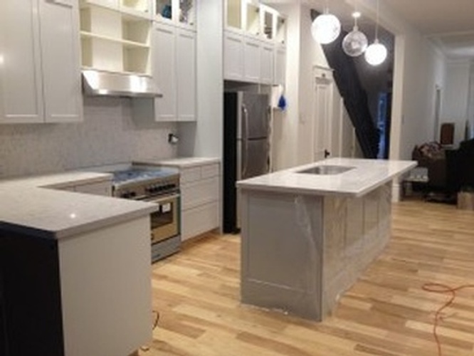 White Cabinets and Kitchen Countertop by AABA Kitchen Cabinets and Countertops - Custom Kitchen Cabinets in Toronto