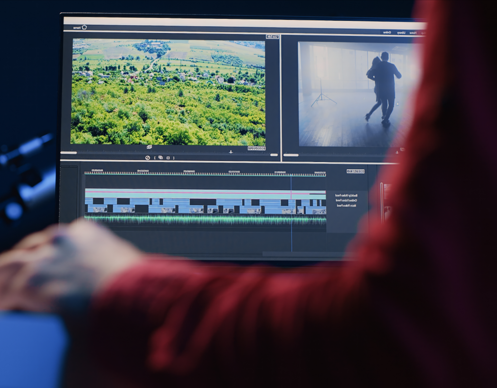 A video editor in Ottawa working on sound mixing on an audio console.