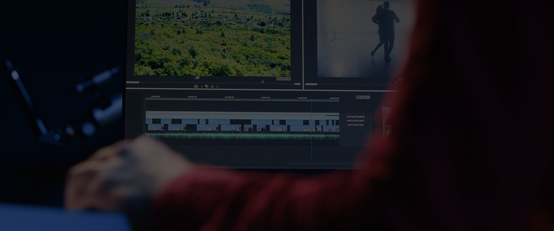A video editor in Ottawa working on sound mixing on an audio console.