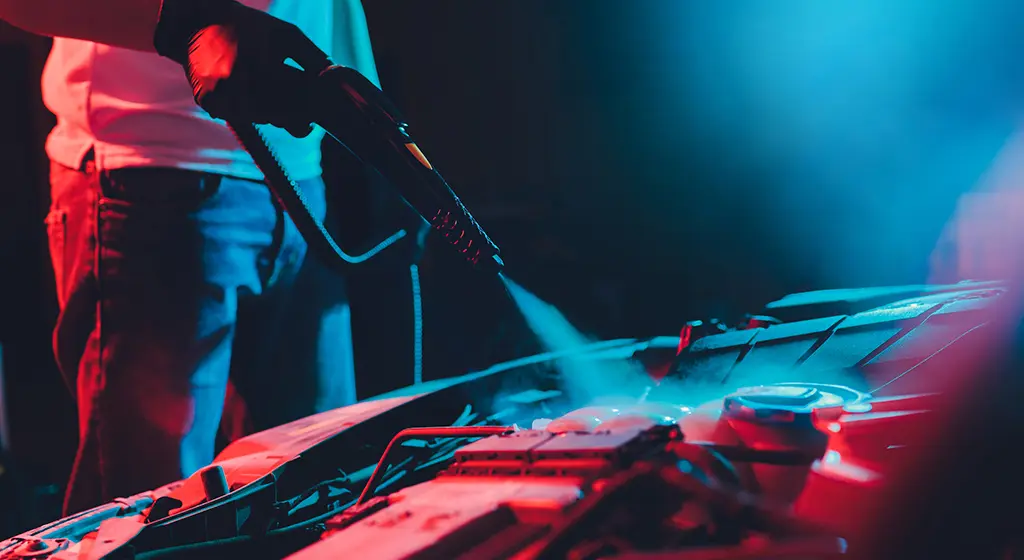 Technician performing Car Steaming in Toronto on front seats