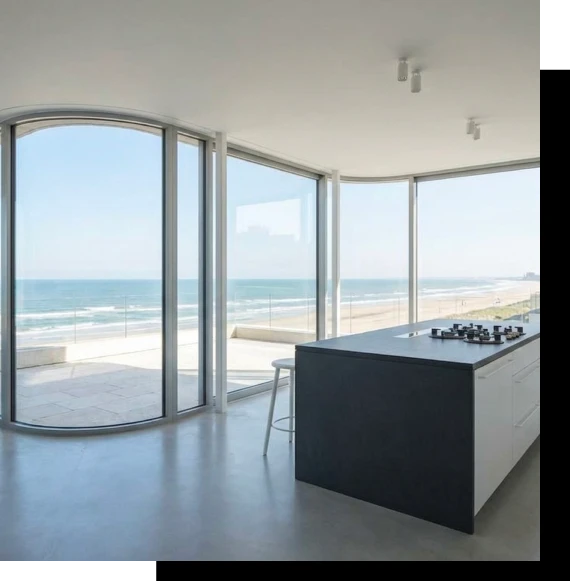 Interior space framed by curved windows that enhance panoramic outdoor views.