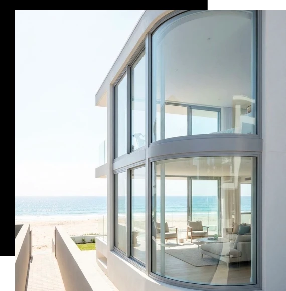 Modern residence using curved window systems to complement sweeping architectural lines.