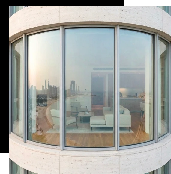 Installers carefully position glazing frames during the installation of an aluminum window system in a Gold Coast residence.