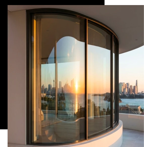 Installers carefully position glazing frames during the installation of an aluminum window system in a Gold Coast residence.