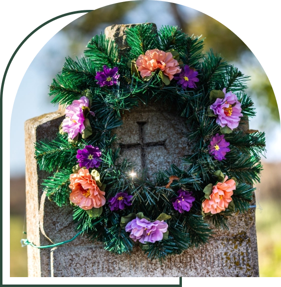 Gravesite floral arrangements placed carefully