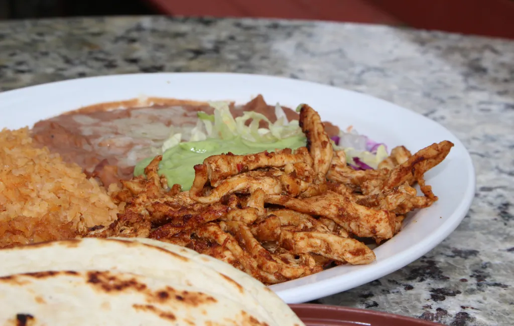 Chef preparing plates at an authentic Mexican restaurant in Little Rock
