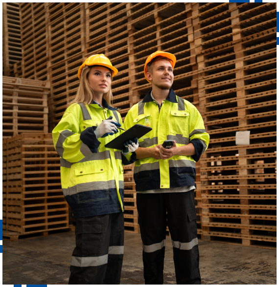 Worker reviewing plans for custom pallet services in Stockton