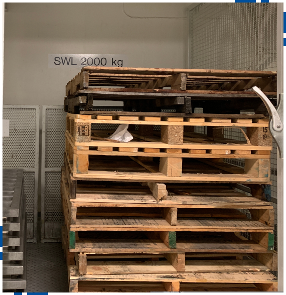 Worker reviewing requirements for custom pallet services in Rocklin