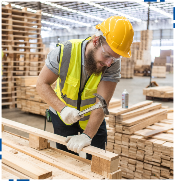 Technician reviewing specifications for custom pallet services in Roseville