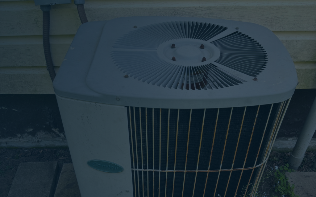 Air conditioning services in Lockport technician repairing AC unit
