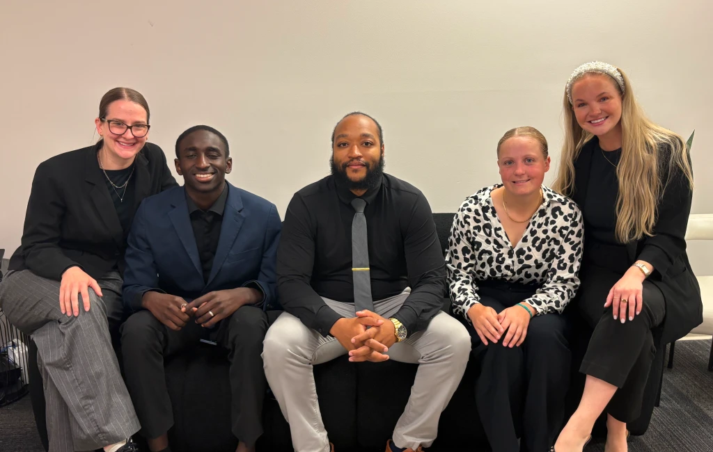 Team reviewing reports for telecom cost reduction planning


