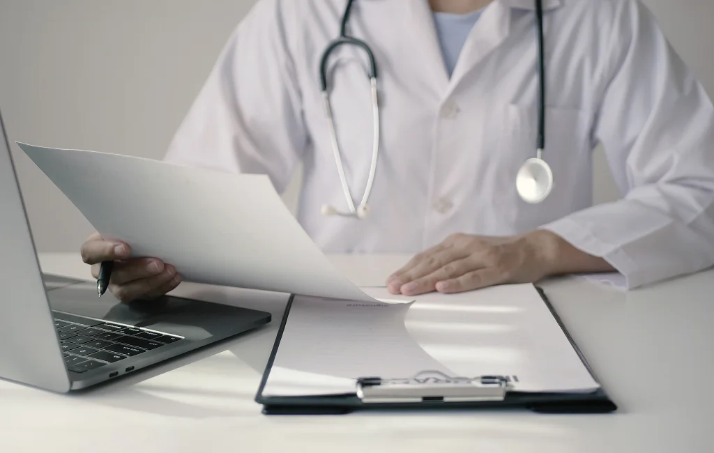 Attorney reviewing case files related to medicolegal services

