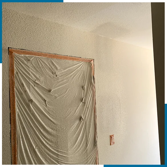 Drywall patch repair services in Menifee matching wall texture.