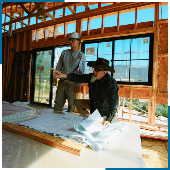 Dry wall contractor in Menifee reviewing repair progress with a homeowner.