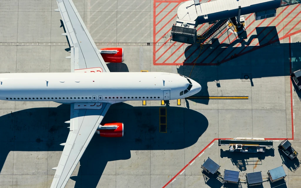 Team reviewing commercial aircraft marketing services for airlines.