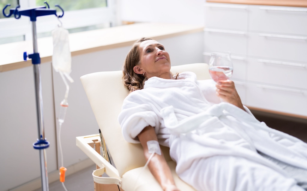 Client relaxing during IV therapy in Minneapolis