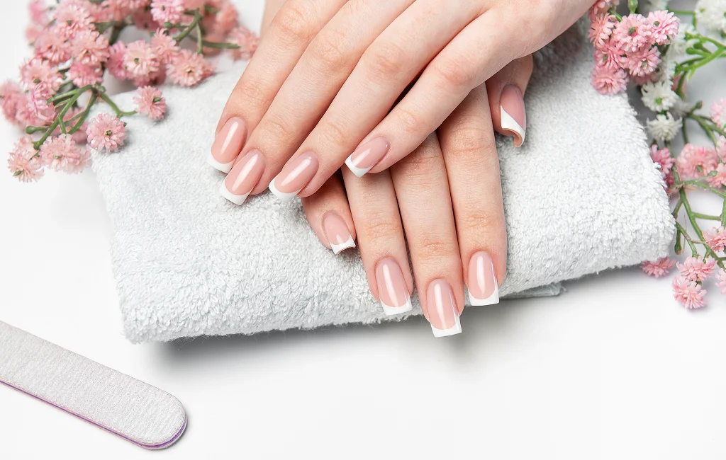 Technician creating nail enhancements in West Hartford with detail