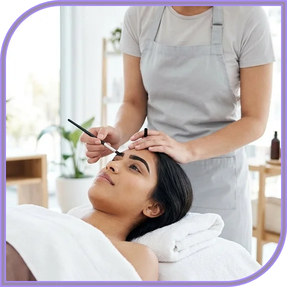 Technician applying eyelash tinting in West Hartford