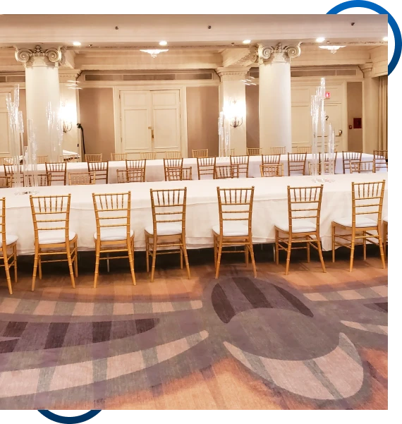 White chairs lined up for party equipment rentals in Mississauga at an outdoor ceremony.