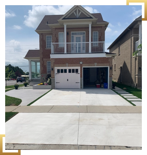 A finished residential driveway completed through residential and commercial concrete services at a property in Mississauga.