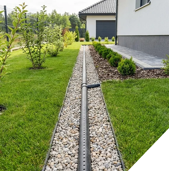 A patio area surrounded by fresh planting beds following landscaping services in Frisco, TX.