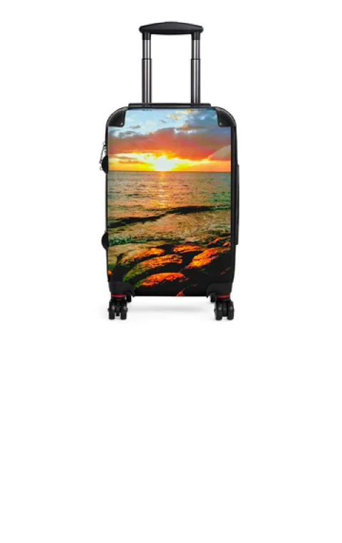 Family carrying suitcases with custom photo printing on luggage at a train station.