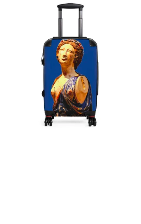 A backpack with bright photo printing on luggage being packed for a trip.