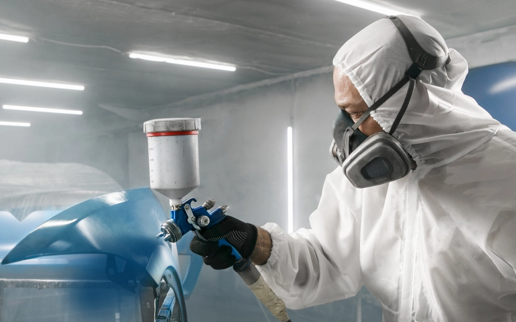 Technician replacing spray booth supplies and filters in Poughkeepsie, NY