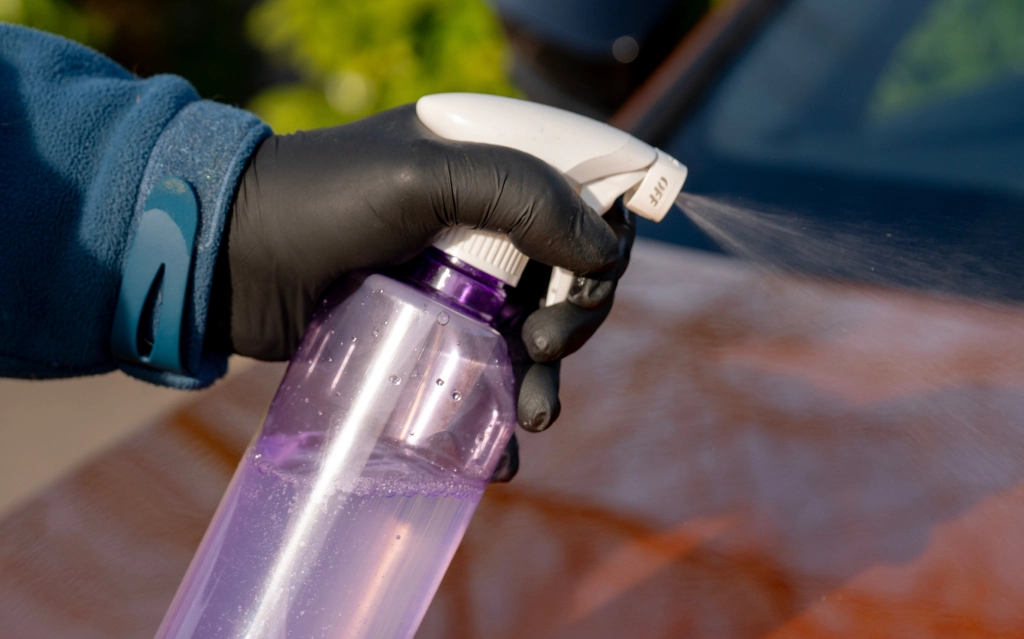 Technician organizing automotive chemicals and cleaners in Poughkeepsie, NY