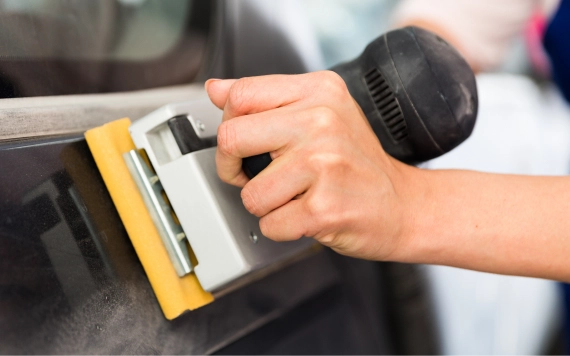 Customer reviewing tools at auto body paint and supplies retail in Poughkeepsie, NY