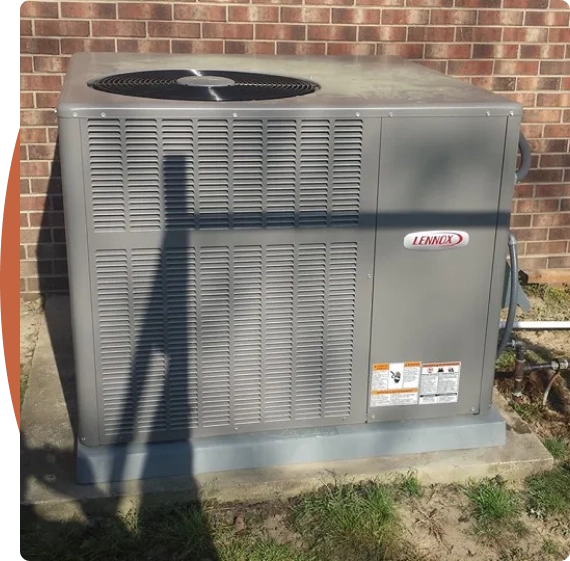 An HVAC contractor reviewing airflow inside an attic space.