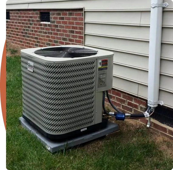 A technician performing diagnostics as part of HVAC services in Raleigh in a utility room.
