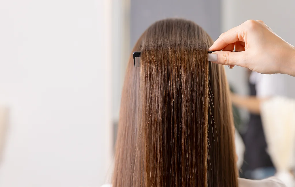A stylist applies hair coloring in Vero Beach on a client.



