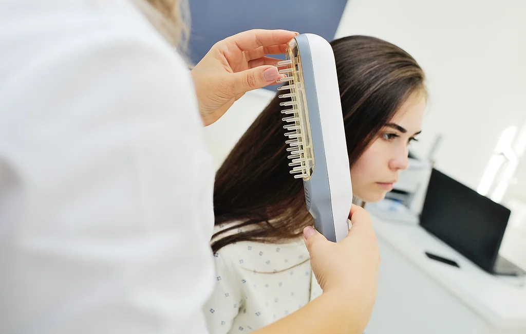 A stylist fits hair toppers in Vero Beach for a client.



