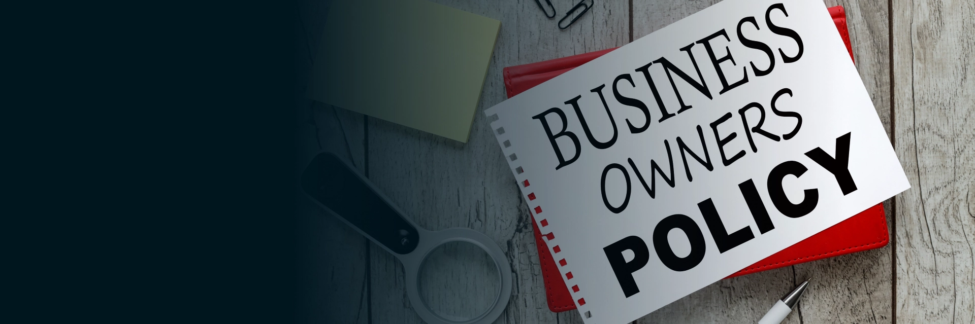Business owner reviewing a business owners policy in Hattiesburg office