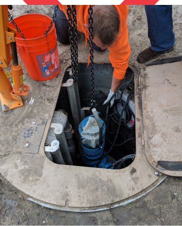 An experienced HVAC equipment manufacturer's representative discussing radiator specifications with a project manager on site.