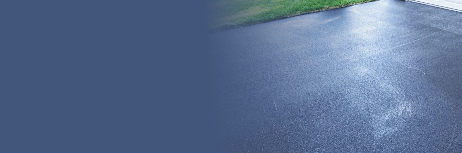 Technician performing driveway pressure wash in Edmonton on a residential concrete surface.