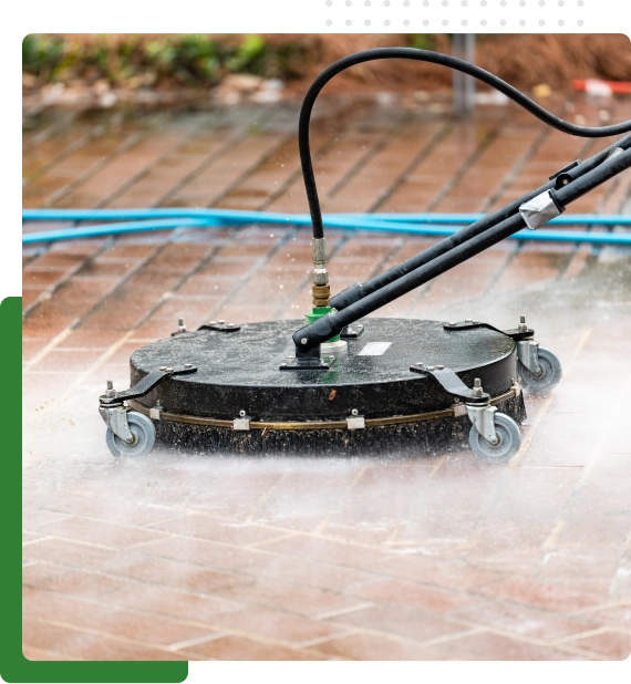 Walkway being cleaned during outdoor building maintenance in Edmonton.