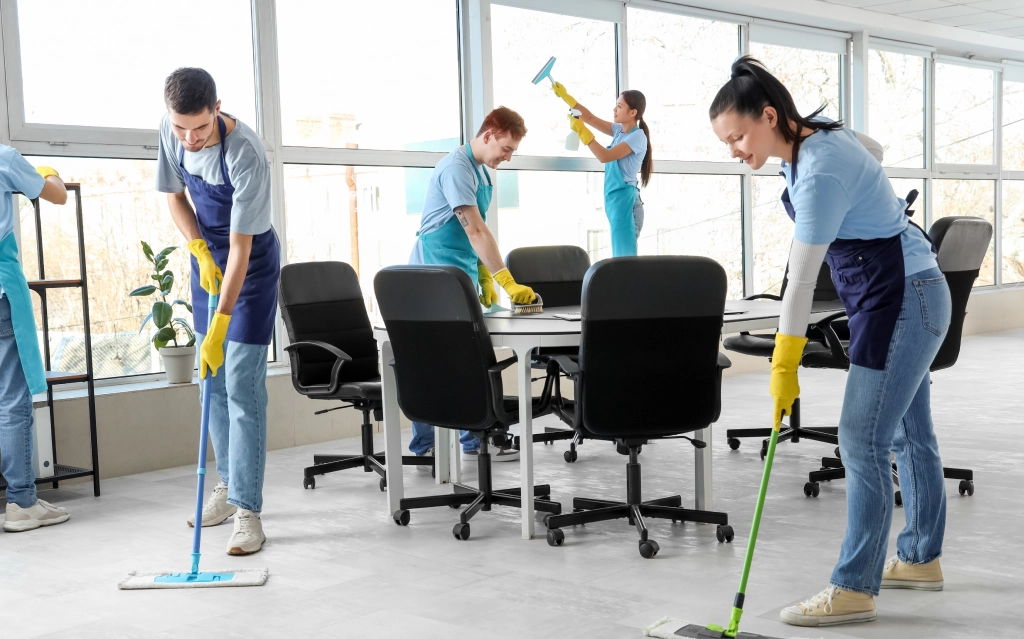Team performing office cleaning services in Edmonton inside a modern workspace.