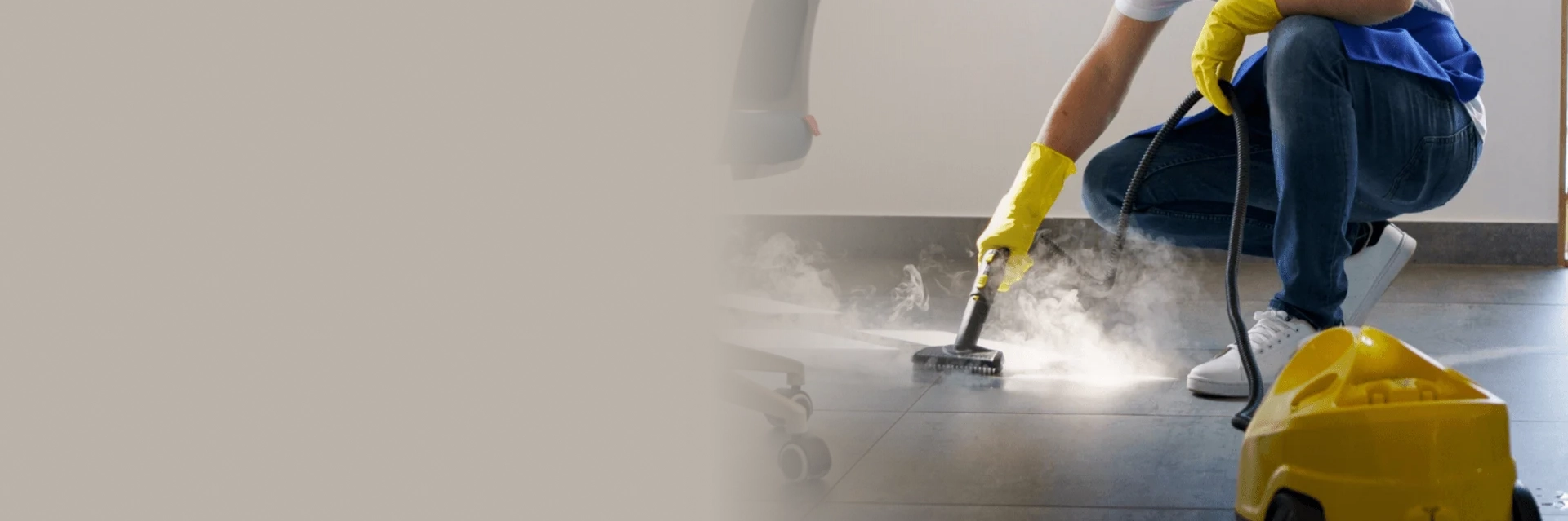 Technician performing floor strip services in Edmonton inside a commercial building.