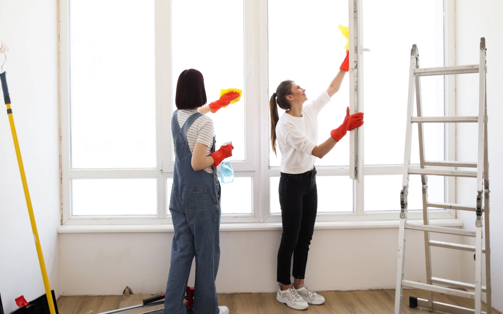 Team completing move-out cleaning services in Edmonton inside an empty apartment.
