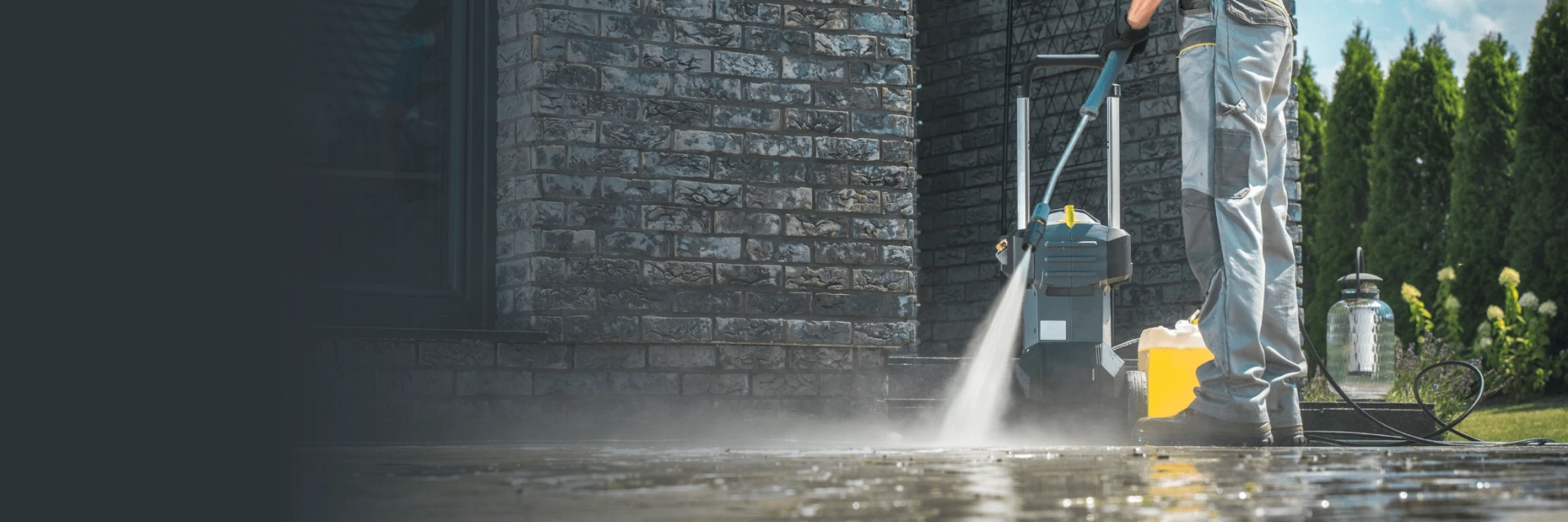Operator using ride-on machines to clean a large commercial floor.