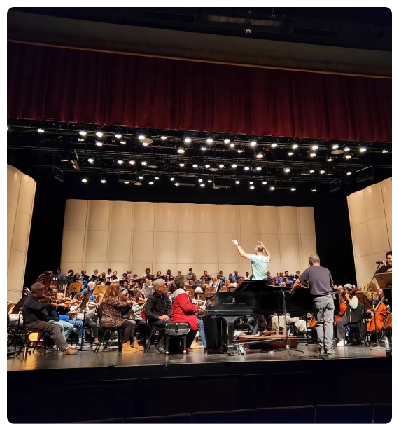 A collaborative rehearsal in a theater setting developed through composer and songwriter services in New York.