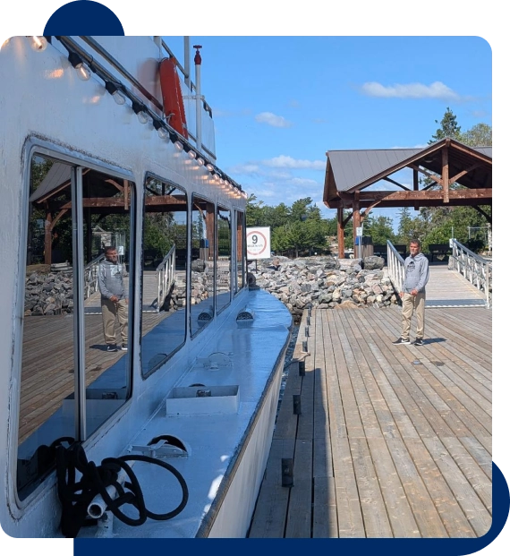 Friends sharing conversation on the deck of a boat during a scenic group outing.